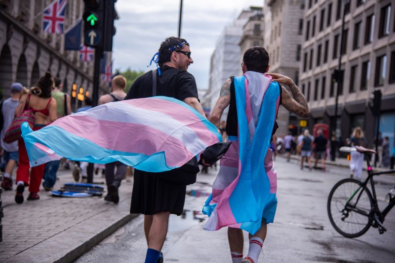 Protestors are adorned in flags during the London Trans+ Pride Protest. The march comes against a backdrop of growing anti-trans hostility. (Photo by Loredana Sangiuliano / SOPA Images/Sipa USA)
