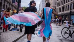 Protestors are adorned in flags during the London Trans+ Pride Protest. The march comes against a backdrop of growing anti-trans hostility. (Photo by Loredana Sangiuliano / SOPA Images/Sipa USA)