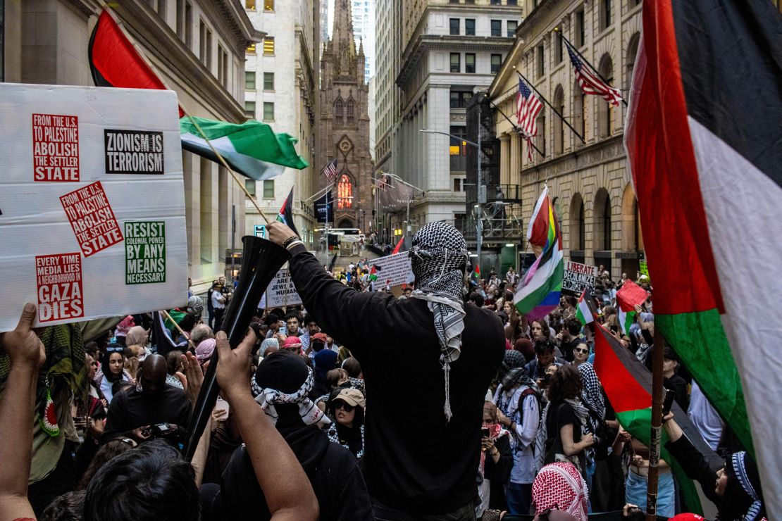 Demonstrators hold a rally in support of Palestine outside the Nova Music Festival Exhibition in New York City on June 10, 2024. The exhibition pays tribute to the victims of the October 7 attack by Hamas on an Israeli music festival.