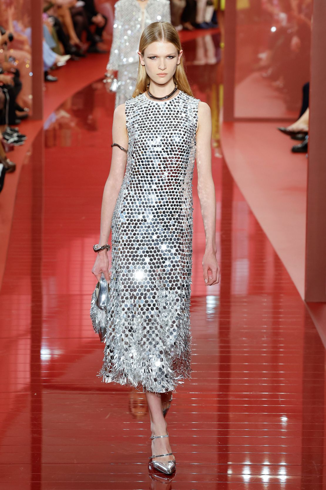 A long sleeveless gown and pencil-skirt co-ord adorned with all-over mirrored paillettes was a standout look.