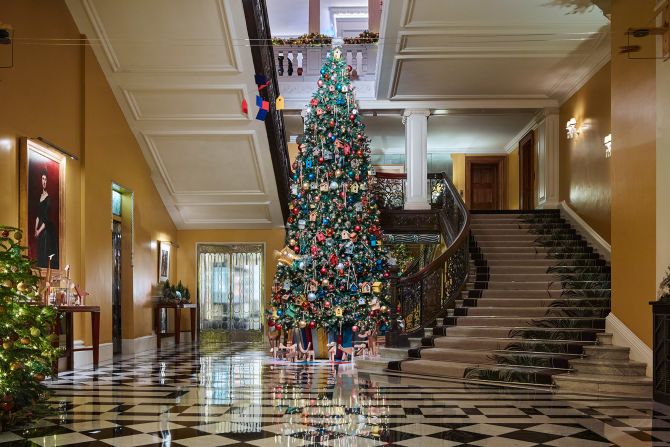 <strong>Claridge's:</strong> A designer is tapped each year to create Claridge's lobby tree. Sir Paul Smith is behind the 2024 tree, which features more than 100 birdcages.