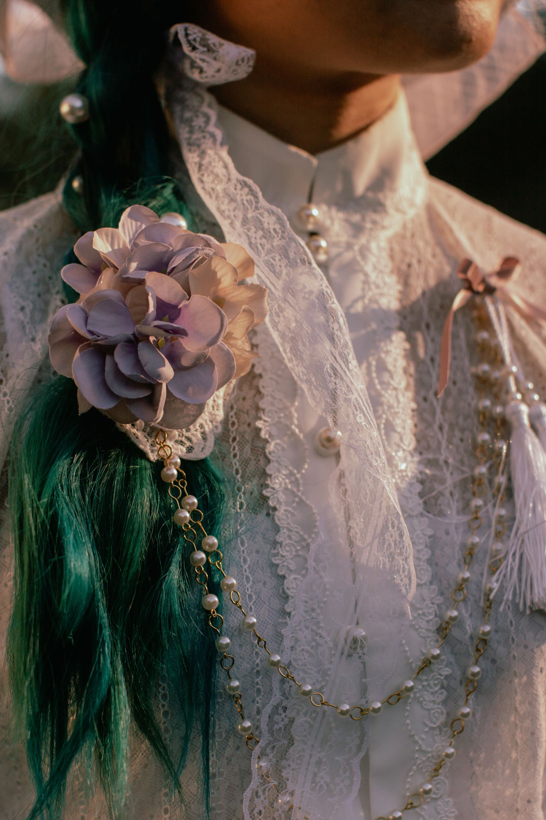 Kandace accessorized her outfit with pearls, lace, and flowers, while attending a tea party in the Morcom Rose Garden in Oakland, California, on Feb. 25, 2021. Lolitas often wear wigs in combination with other headwear such as hair bows or bonnets.