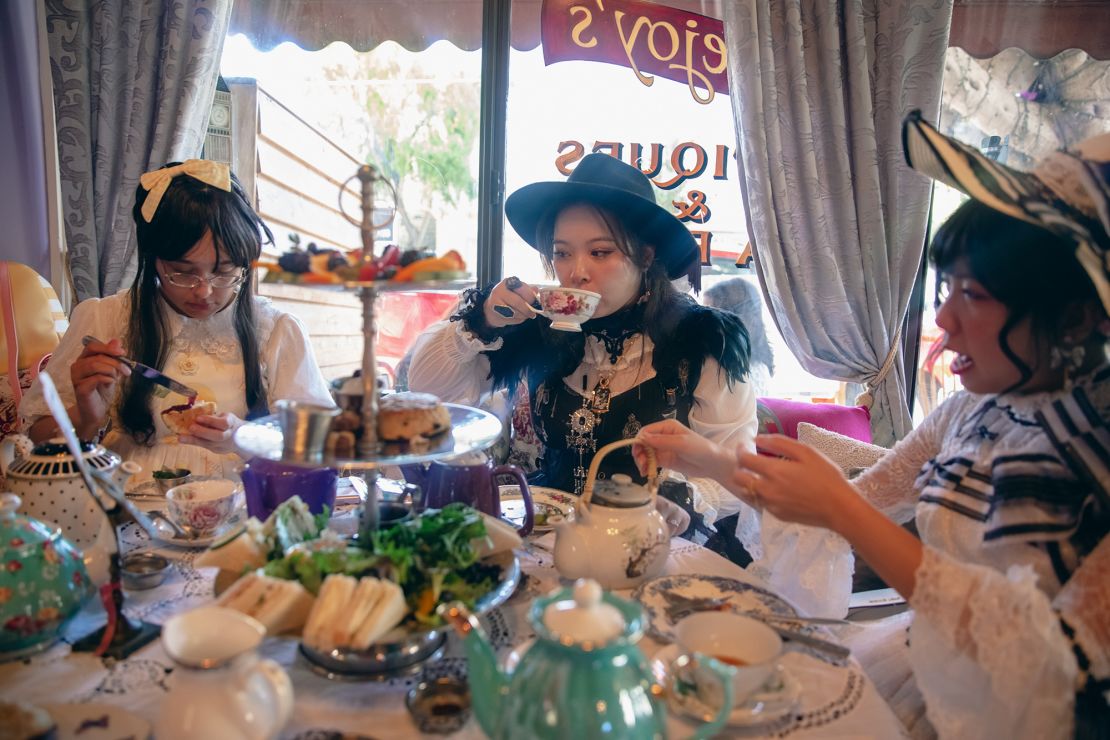 From left: Lauren, Ella, and Nghi enjoy a tea party at Lovejoy's Tea Room in San Francisco, California, on September 10, 2023. Lolita tea parties and similar events provide an opportunity for community-building among Lolitas, as well as a chance to flaunt their best fashions.