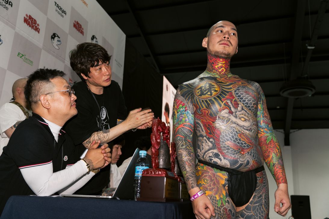 A man exhibits his tattoos at a tattoo convention in Seoul, South Korea.