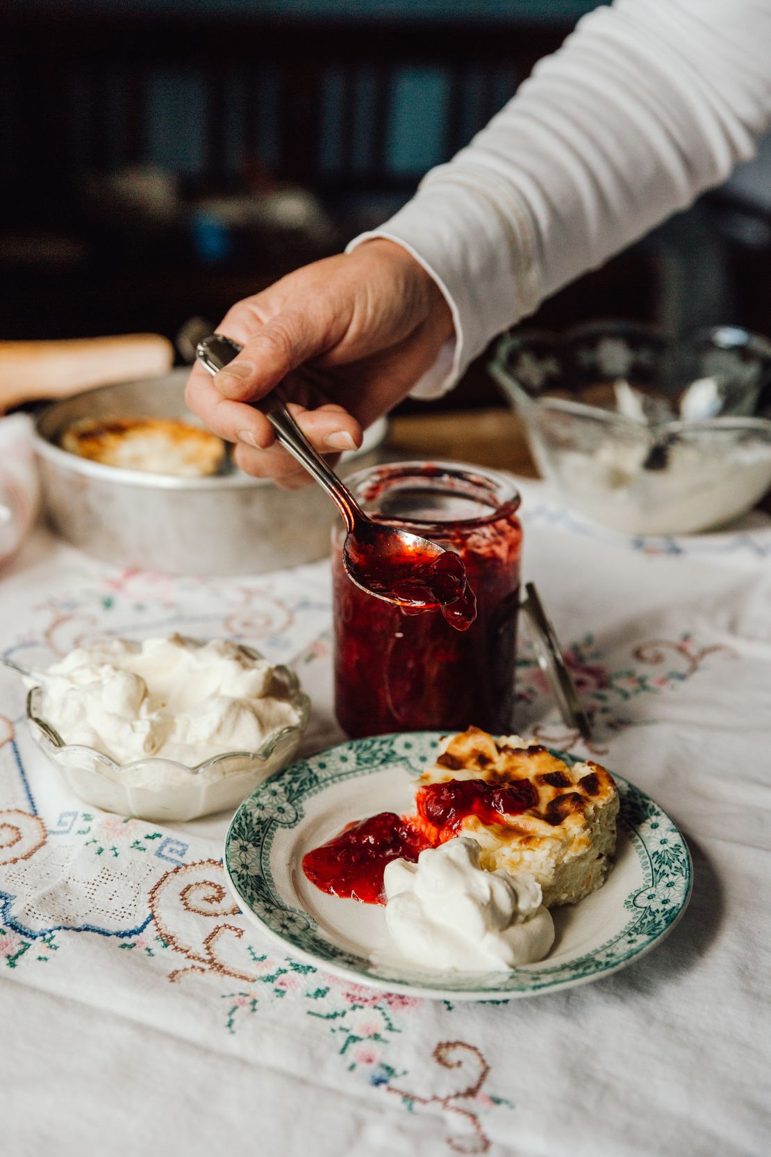 Småland cheesecake served with whipped cream and jam.