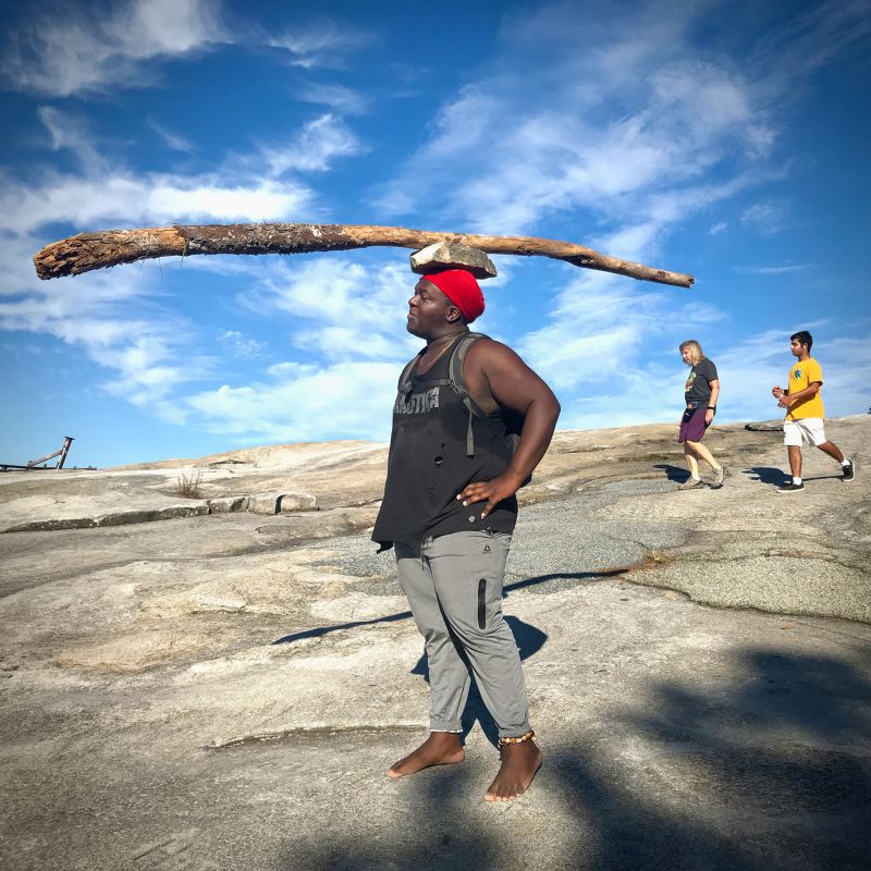 What happened when a White man carrying a large wooden cross met a
