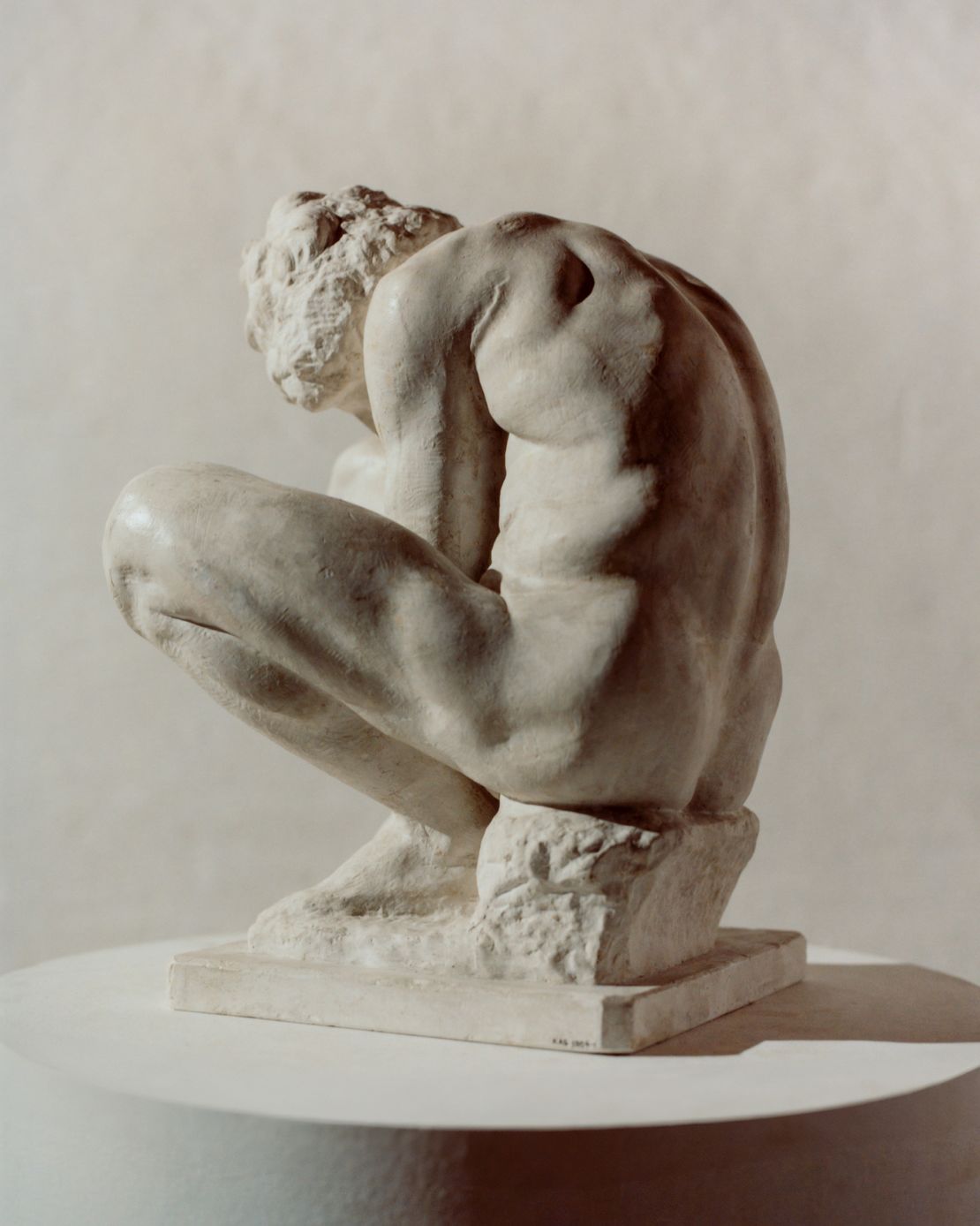 A marble reproduction of “Crouching Boy” made in 1915. The original is housed in Saint Petersburg's State Hermitage Museum.