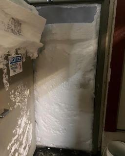 Snow blocks the door of the maintenance shop of the ski resort Sierra-at-Tahoe on Friday, March 1, 2024.