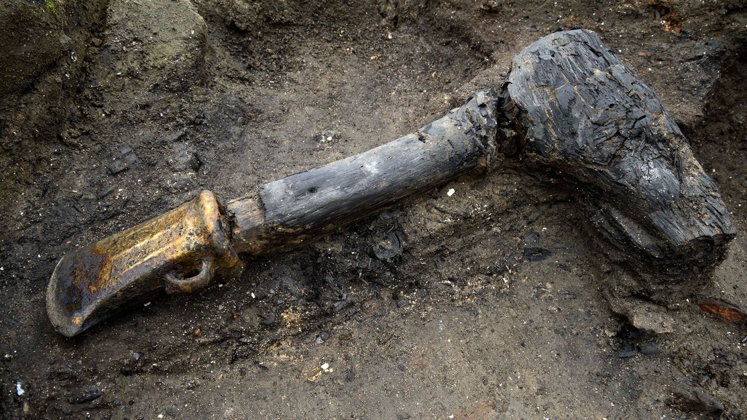 A metal axe head with wooden shaft was among the many well-preserved artifacts discovered at Must Farm, near Peterborough in the county of Cambridgeshire in England.