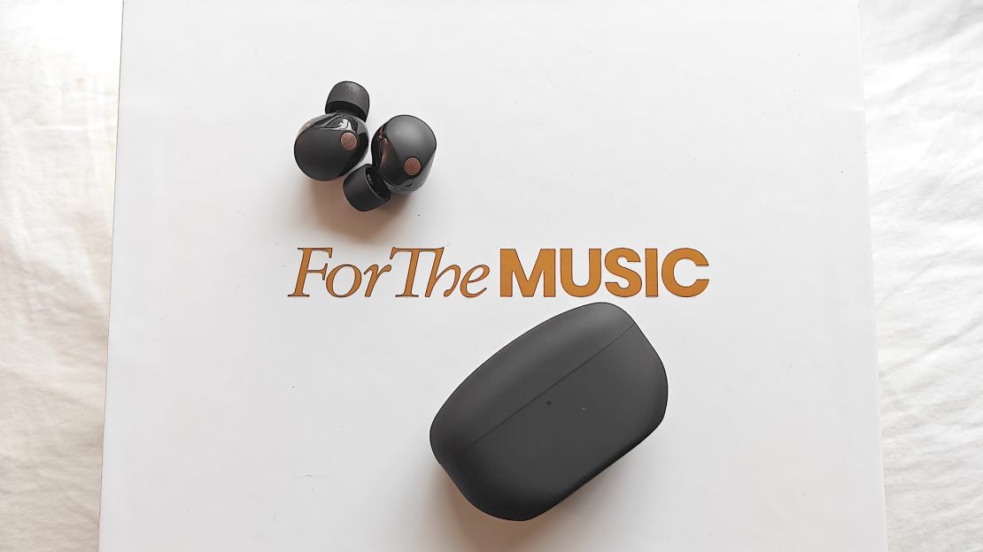 Wireless earbuds and their case on a box that reads "For The Music."