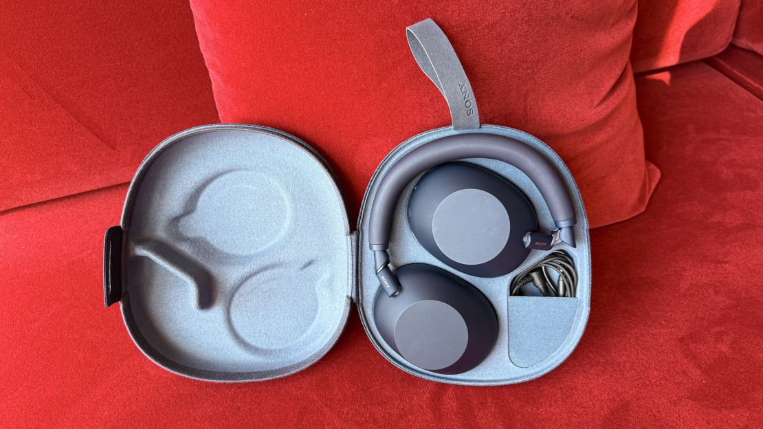 The blue Sony XM6 folded flat in their case