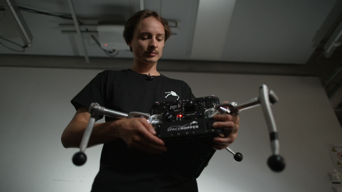 ETH Zurich student Valerio Schelbert holds SpaceHopper.