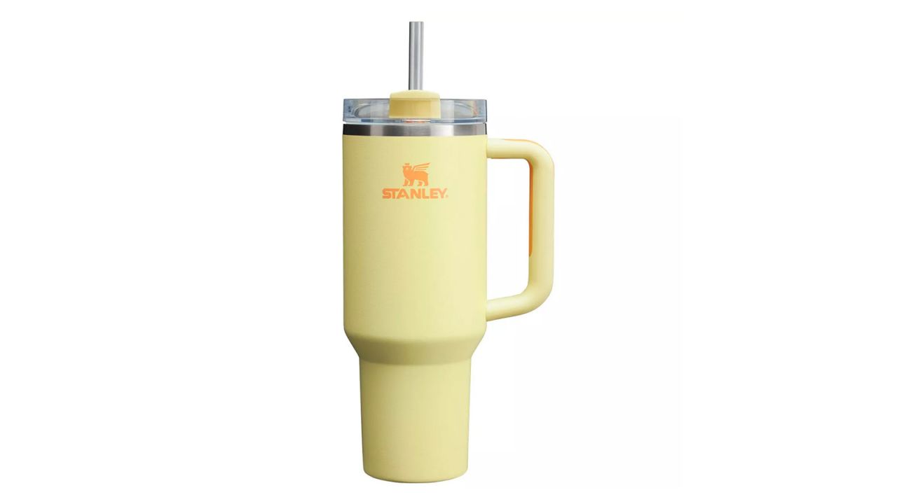 A sunshine yellow Stanley 40-Ounce Stainless Steel H2.0 FlowState Quencher Tumbler on a white background.