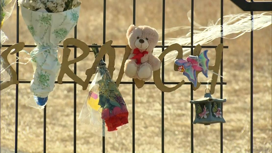 A makeshift memorial for Maggie Long is seen on the gate leading to her family's home in December 2017 in Bailey, Colorado.