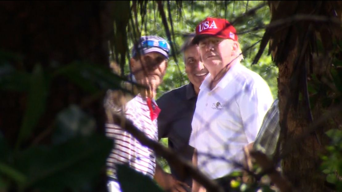 Then-President Donald Trump is seen on the golf course at Trump International Golf Club in West Palm Beach, Florida, on December 29, 2017.