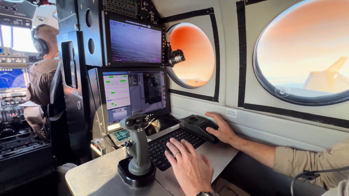 Cameras and radar are used on a plane flying over the Pacific looking for smugglers.