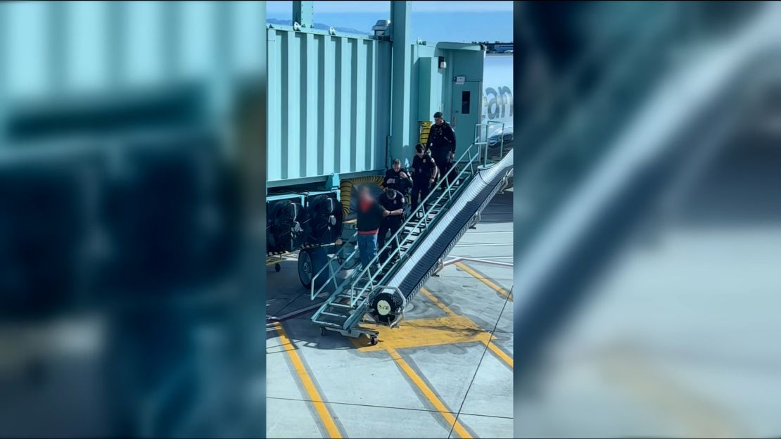 Video from the incident shows four police officers escorting someone from the plane. It’s not clear whether there was an arrest or if any charges are pending.