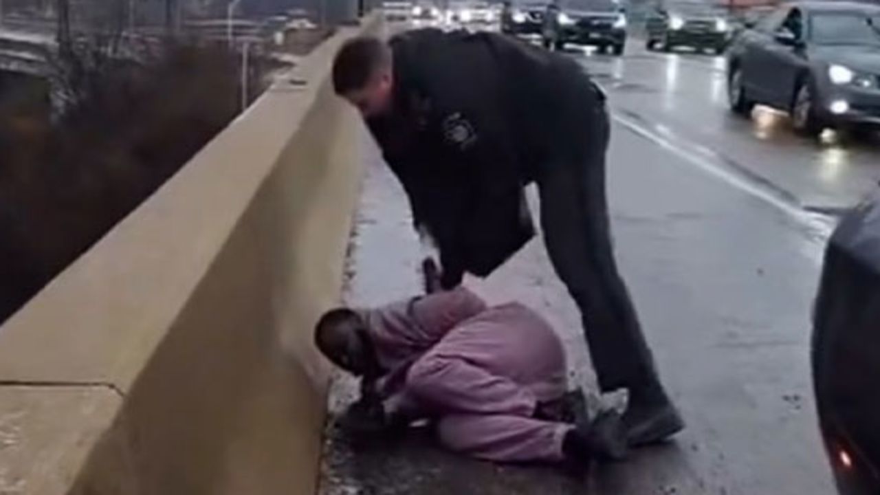 A still from a video shows a Pennsylvania state trooper detaining Darius McLean, husband of Philadelphia's head of LGBT Affairs Celena Morrison.