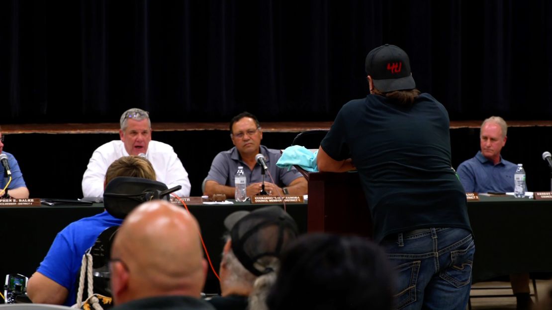 Mayor Cody Smith, left, speaks during an Uvalde City Council meeting on March 12.