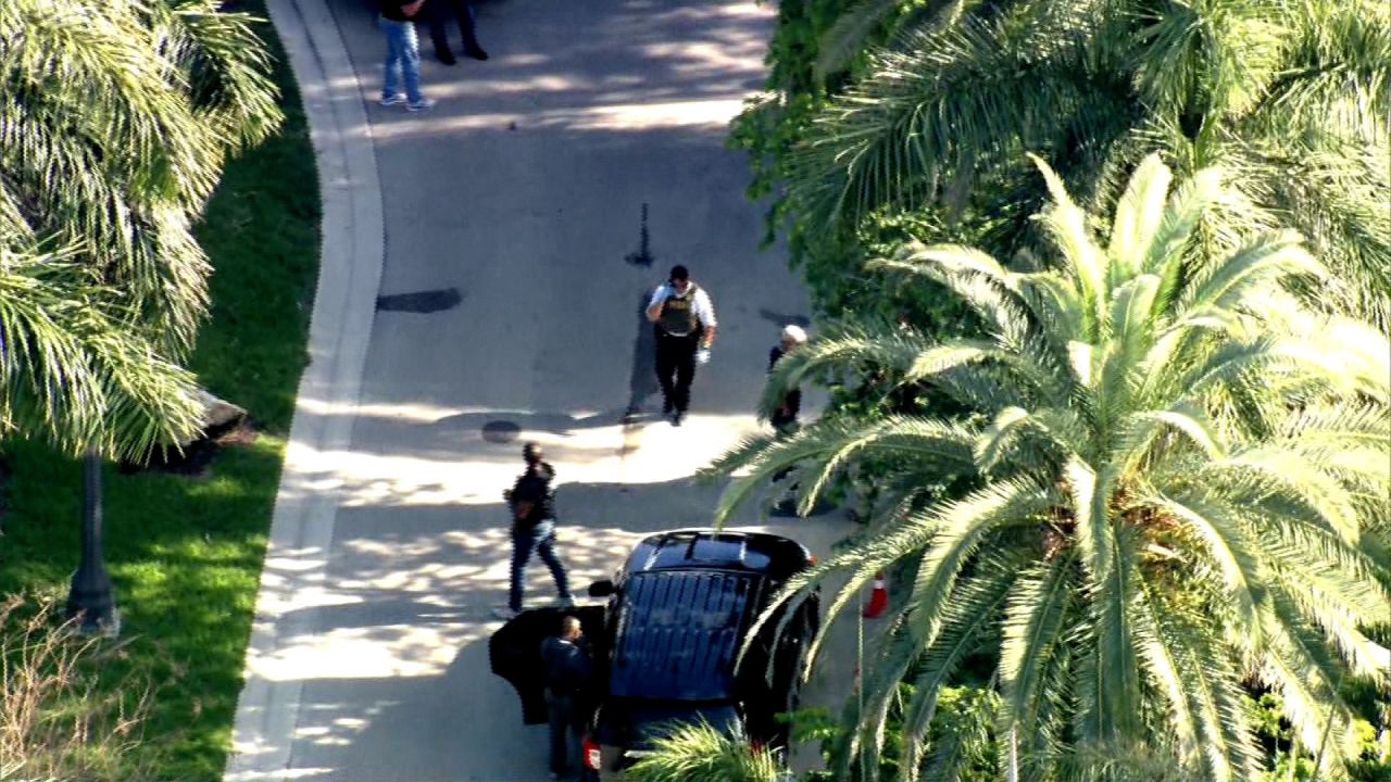 Members of law enforcement are seen outside of Sean "Diddy" Combs' home in Miami on March 25, 2024.