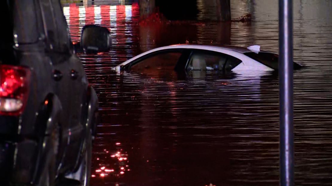 A car is seen submerged in floodwater in Rock Hill, Missouri, on April 2, 2024.