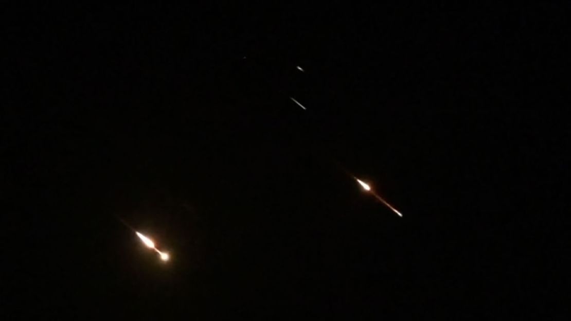 Israeli air defenses intercept some Iranian strikes over Jerusalem early Sunday, local time.