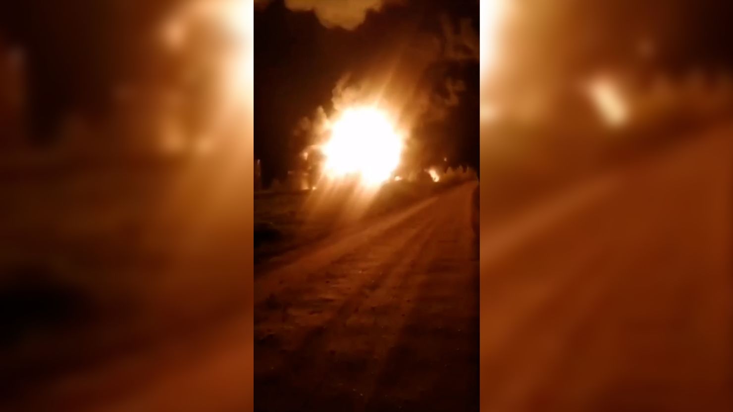 This screen grab from a video posted on Telegram by Vasiliy Anokhin, the governor of the Smolensk region in Russia, shows a fuel depot on fire on April 20. The video has been geolocated by CNN.