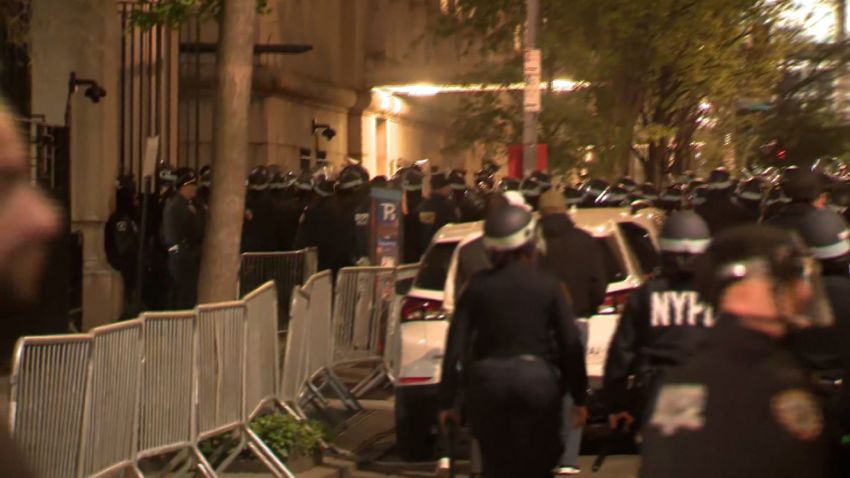 NYPD officers enter Columbia University's campus in New York on Tuesday evening. CNN