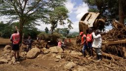 A screengrab taken from video shows an overturned car and collapsed trees in the aftermath of a flash flood in Mai Mahiu, Kenya, on April 29.