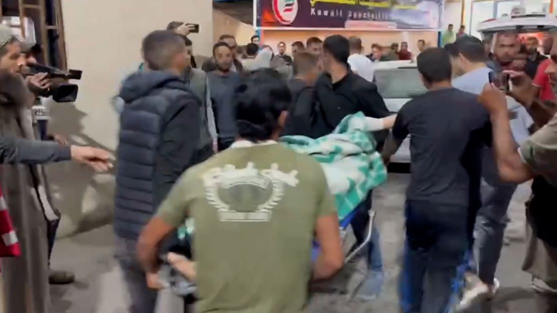 Palestinians arrive at Al Kuwaiti Hospital in Rafah, Gaza, after Israeli air strikes on May 8.