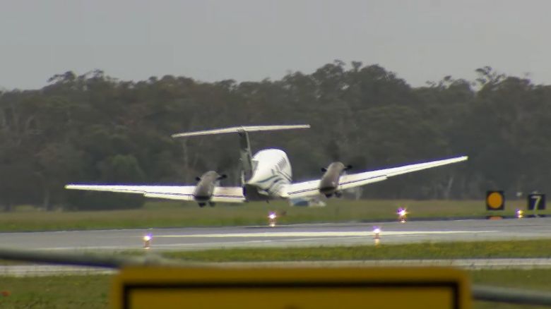 A plane makes successful wheels-up emergency landing in Newcastle, Australia after circling airport for hours, on May 13.