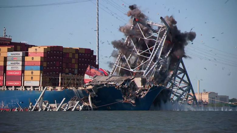 Demolition charges are set off on the wreckage of the Francis Scott Key Bridge in an attempt to free the cargo ship Dali on May 13, 2024.