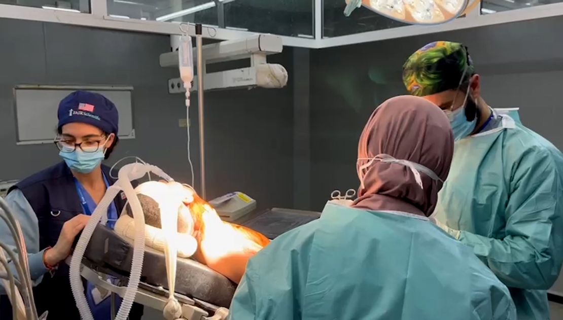 Dr. Ahliah Kattan, left, in an operating room of the European Hospital in northern Rafah.
