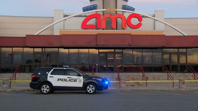 A police car is parked outside of an AMC theater in Braintree, Massachusetts, after a stabbing on Saturday.