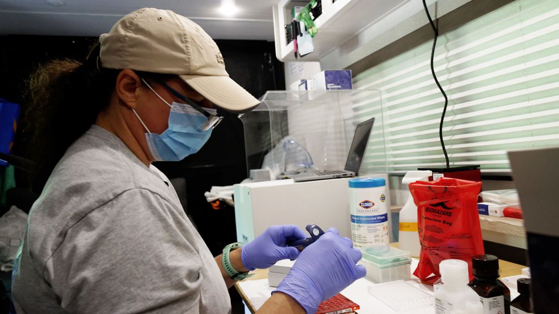 Dr. Lisa Kercher, director of lab operations for St. Jude Children’s Research, works in her mobile lab.