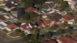 Gliding just feet above suburban homes, two survive emergency small plane landing in Australia on May 26, 2024.