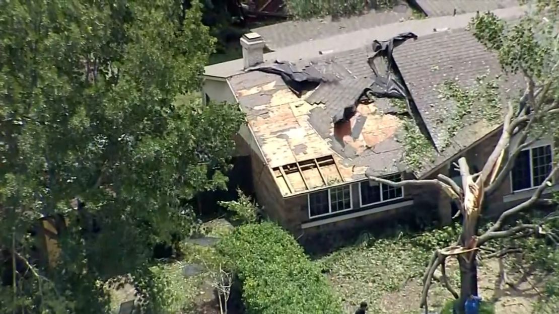Storms shredded a roof in the Dallas-Fort Worth area on Tuesday.