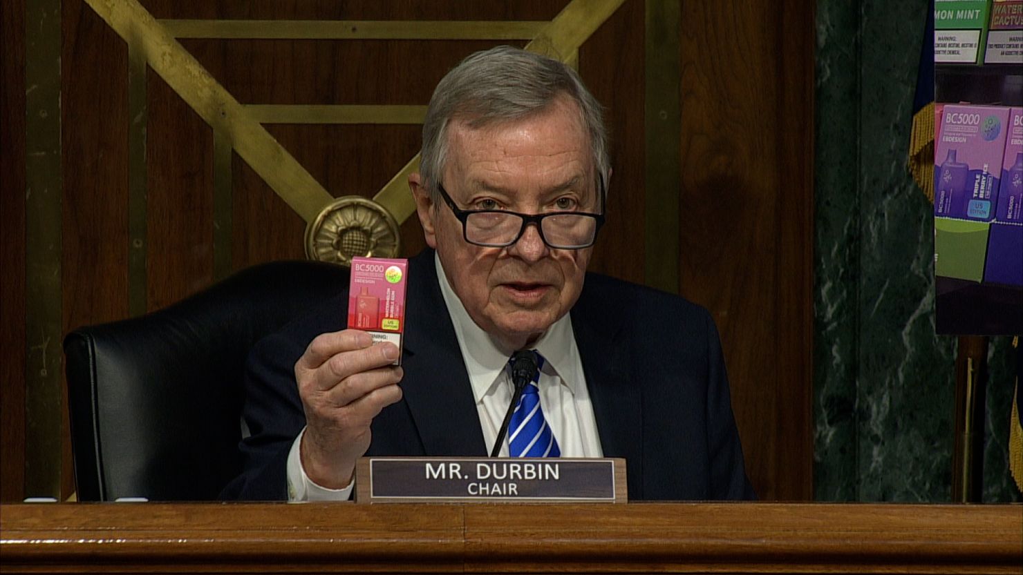 At Wednesday's hearing, Sen. Dick Durbin holds up what he says is an unauthorized flavored e-cigarette product that his staff bought at a vape shop just a mile from FDA headquarters.
