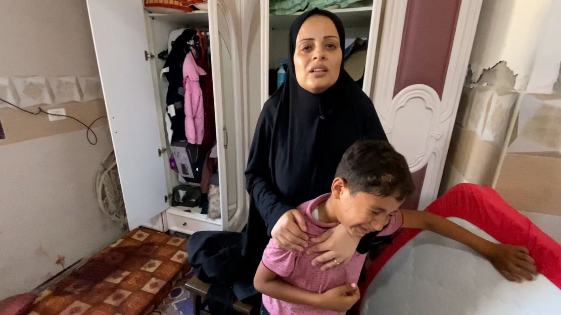 Rasha Abdel Miqdad (left) and her son, Zain (right) pictured on June 12, in Nuseirat, in central Gaza, recall the moment Israeli forces stormed their home on June 8.