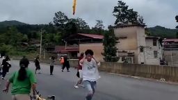 A screengrab taken from video shows suspected Chinese rocket debris falling over Xianqiao?Village,?Xinba?Town, Guizhou Province, China, following a launch.