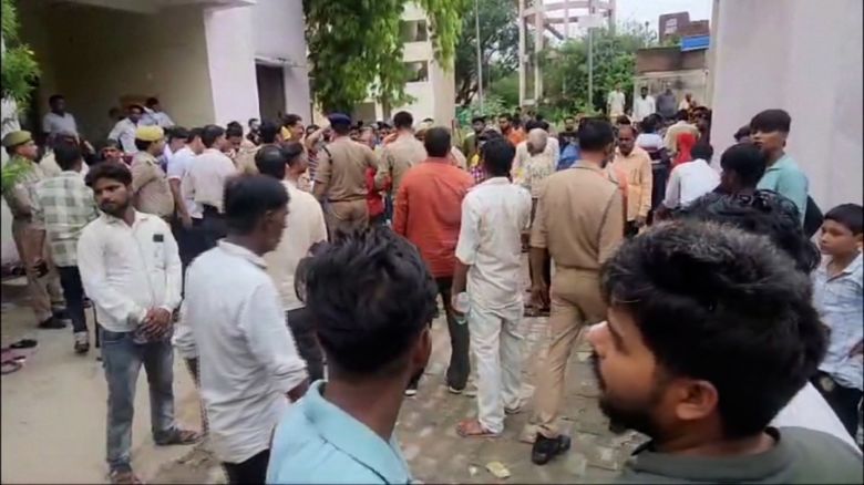 Crowds gather outside the emergency department at Etah hospital following a deadly crush at a religious gathering.