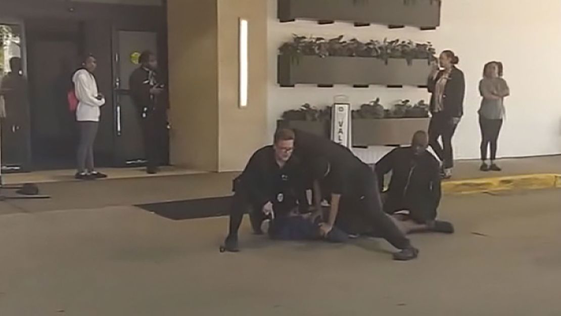 A still image from a video shows former Milwaukee hotel workers holding down D'vontaye Mitchell at the downtown Hyatt Regency on June 30.