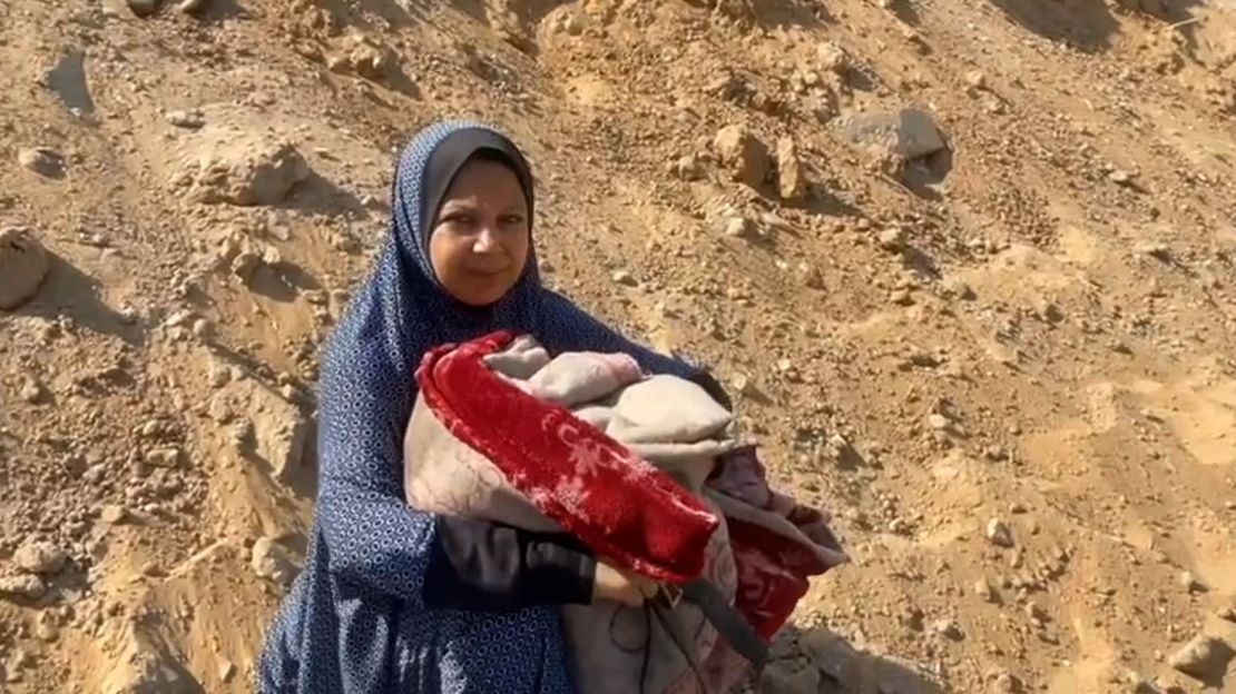 Palestinian mother Umm Ihab Arafat, shown in the Tal al-Hawa neighborhood on Friday, says she has been displaced at least four times since Israel launched its bombing campaign in Gaza.