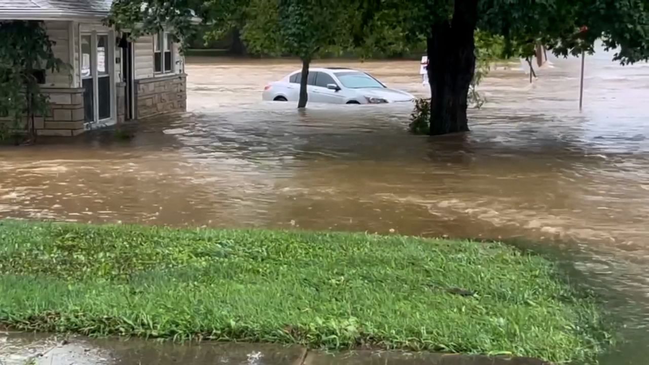 Vehicles are inundated in floodwater Tuesday in the small city of Nashville, Illinois,  after a once-in-a-century rainfall.