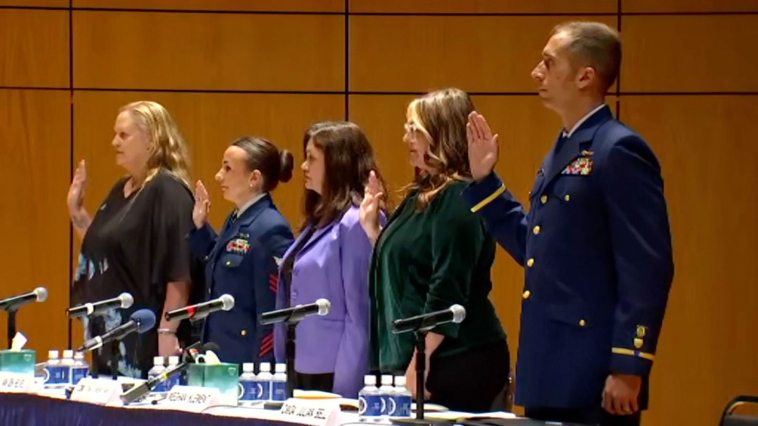 `Five former and current members of the US Coast Guard are sworn in for a hearing with a subcommittee of the Senate Homeland Security Committee on August 8.