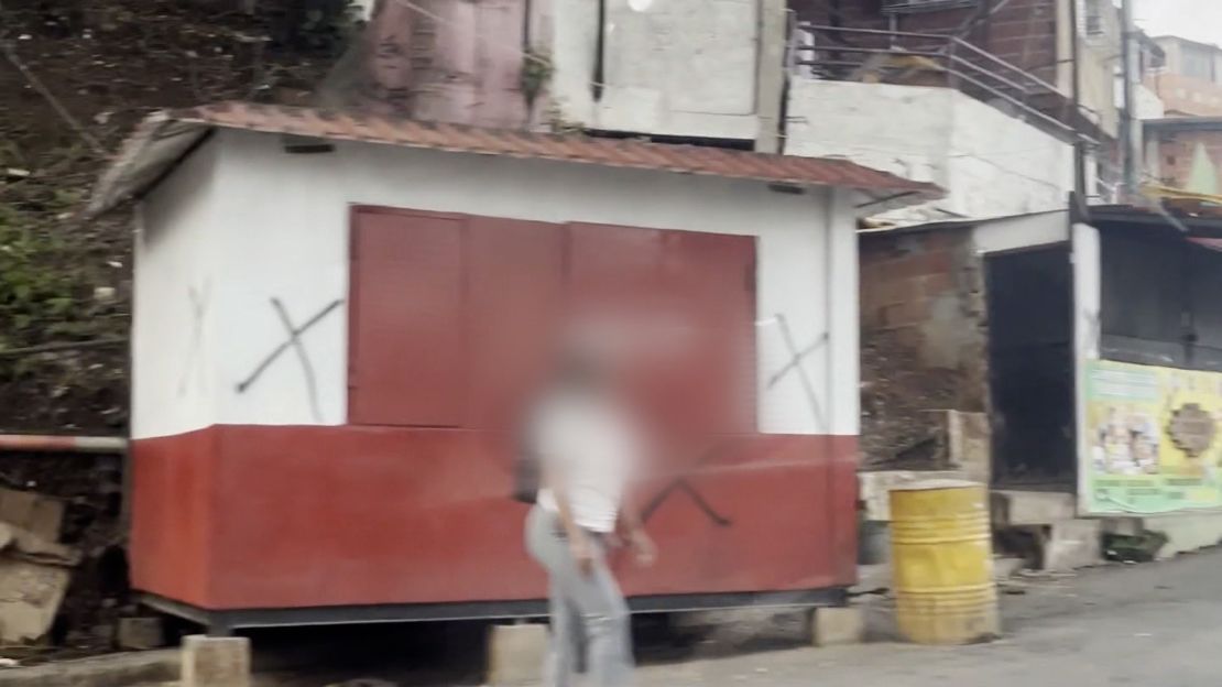 Residents say the black marks were spray painted by a paramilitary unit. Portions of this image have been blurred by CNN to protect identities.