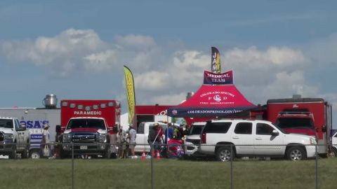 An ambulance is parked outside a medical team tent at the  Pike’s Peak Regional Air Show in Colorado Springs, Colorado on August 17, 2024. More than 100 people were treated for heat-related illness at the event, with five being transported to the hospital. 