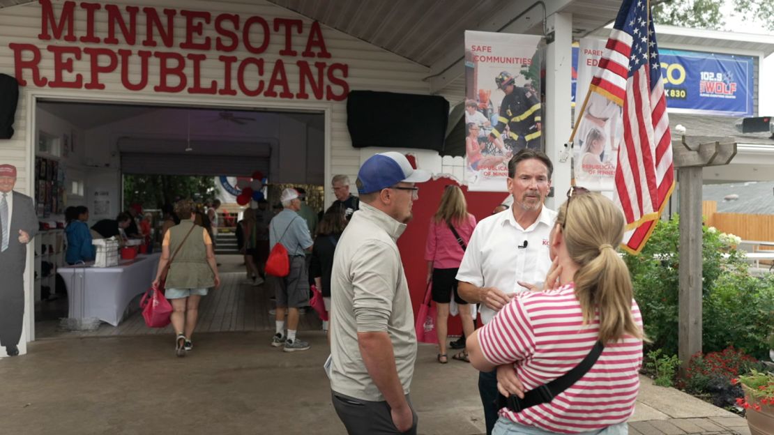 Republican state Sen. Mark Koran, second from right, speaks with constituents at the Minnesota State Fair.