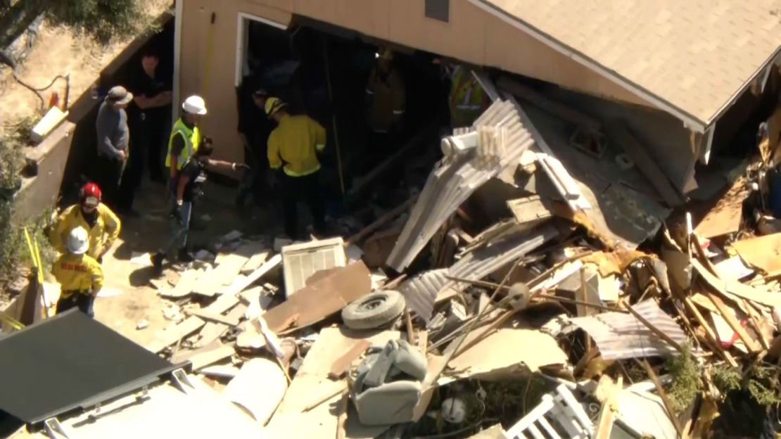 Investigators search the home of Michael Royce Spark on Friday, August 30.