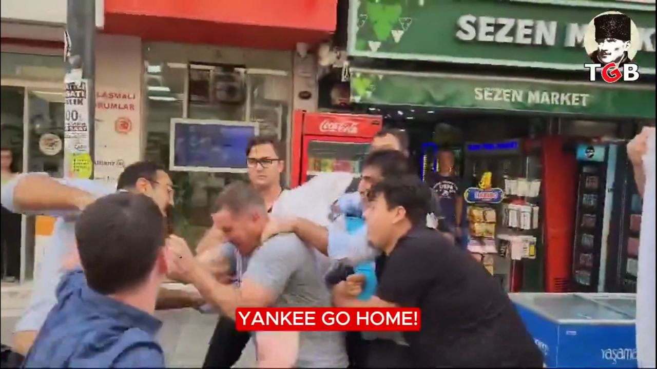 A screen grab from a video posted on X shows a small crowd assaulting two US Marines in Turkey, the US Navy says.